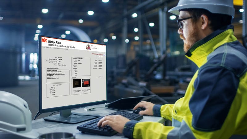 Person using laptop with Job Trac site displayed on screen