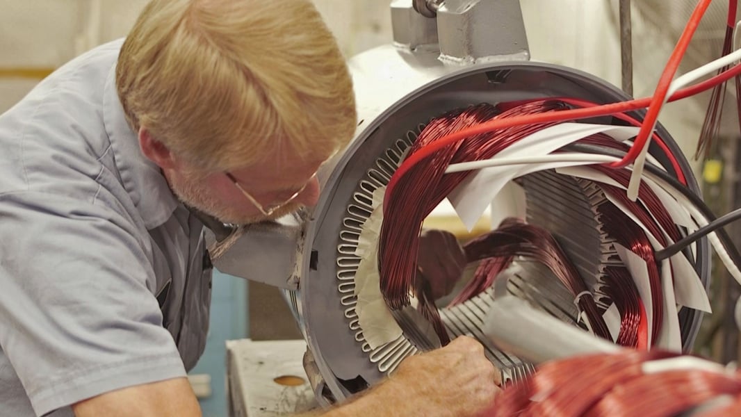 Person rewinding electrical motor